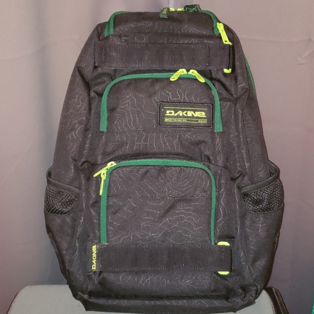 Backpack with skateboard carrier and laptop sleeve